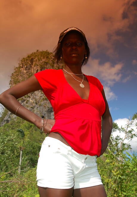 Gracile hottie Maria L uncovering small tits and sexy ass outside