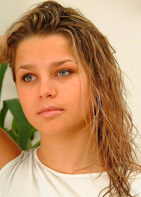 Luscious blond young Mila in tight jeans exhibits big knockers and masturbates 